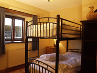 Bedroom in the HorseBarn Holiday Cottage 